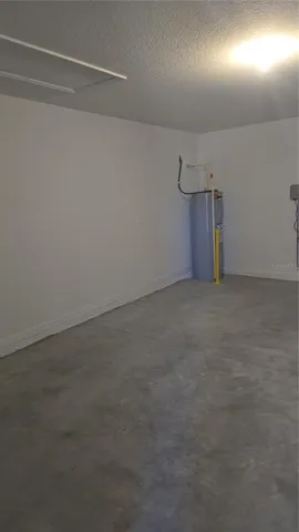 a kitchen with stainless steel appliances kitchen island granite countertop a sink stove and refrigerator