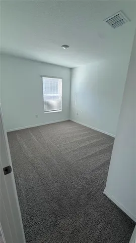 a kitchen with kitchen island microwave and cabinets