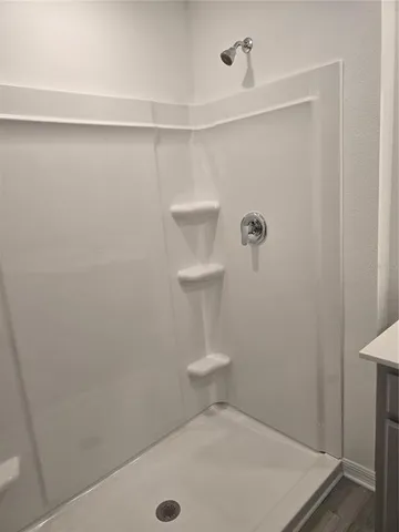 an empty room with a empty space and window