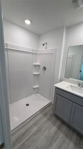 a bathroom with a bathtub and shower