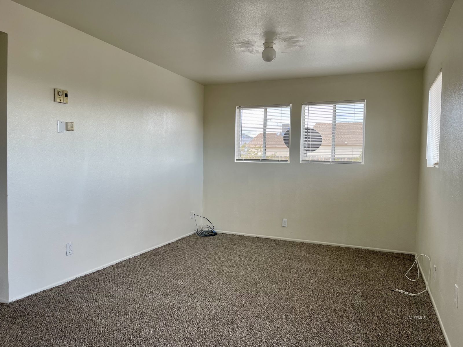 328 North Mono Street Ridgecrest, CA 93555 - Photo 4 of 14 an empty room with windows
