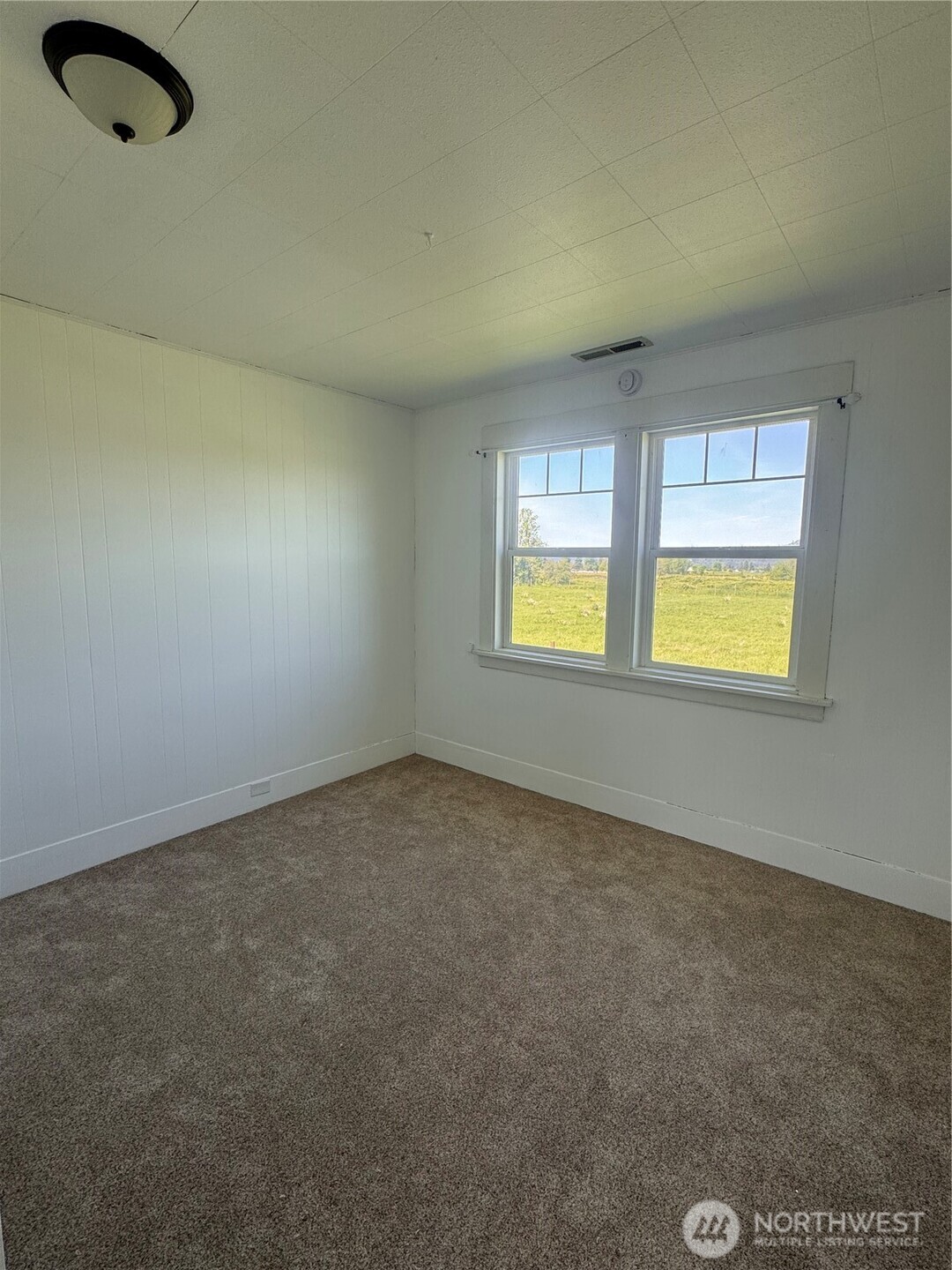 20016 Orville Road East Orting, WA 98360 - Photo 14 of 18 an empty room with windows