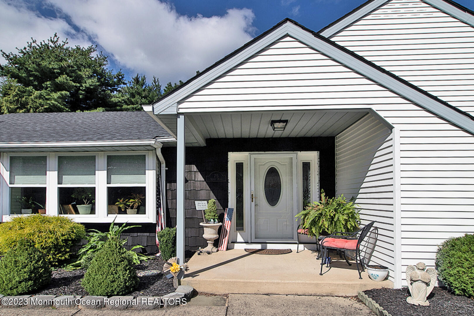 75 Sunset Road, Unit 61 Whiting, NJ 08759 - Photo 2 of 46 a front view of a house with plants