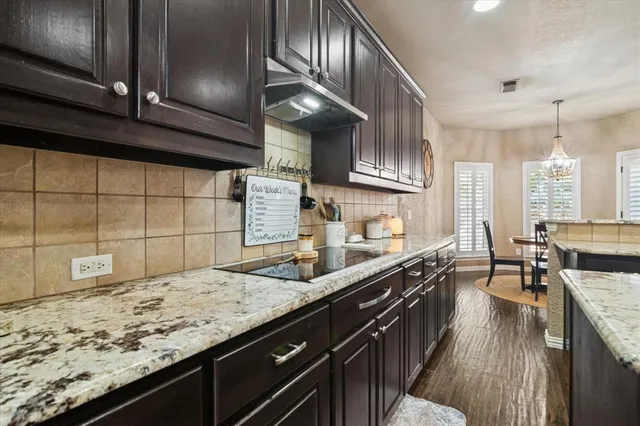 a kitchen with granite countertop lots of counter top space