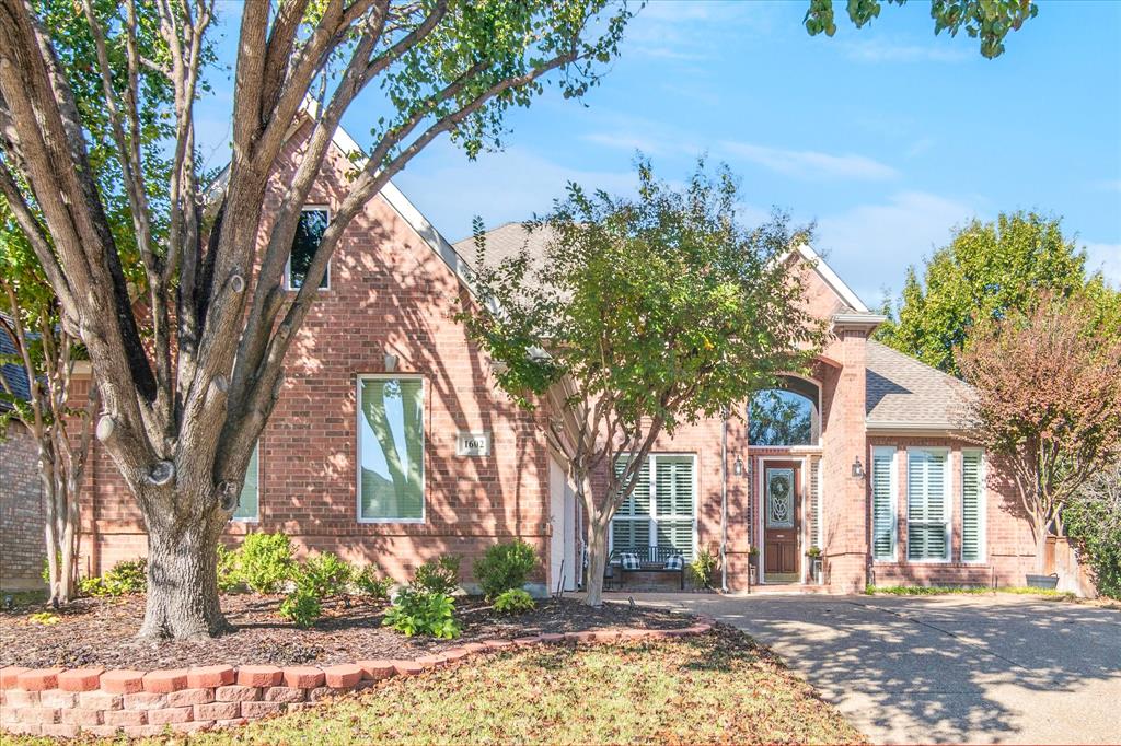 1602 Crown Point Road McKinney, TX 75072 - Photo 2 of 40 a front view of a house with a yard