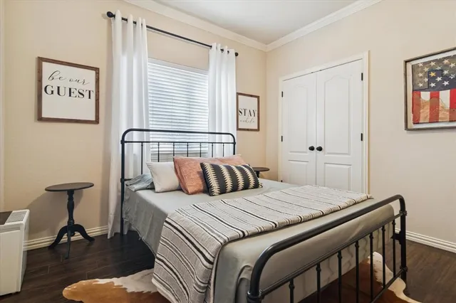 a bedroom with a bed and a table in it