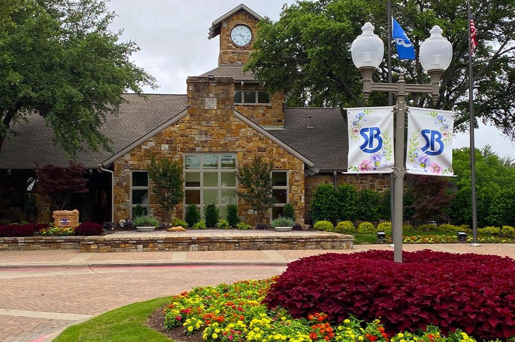 1602 Crown Point Road McKinney, TX 75072 - Photo 38 of 40 a front view of multi story residential apartment building with yard and sign board