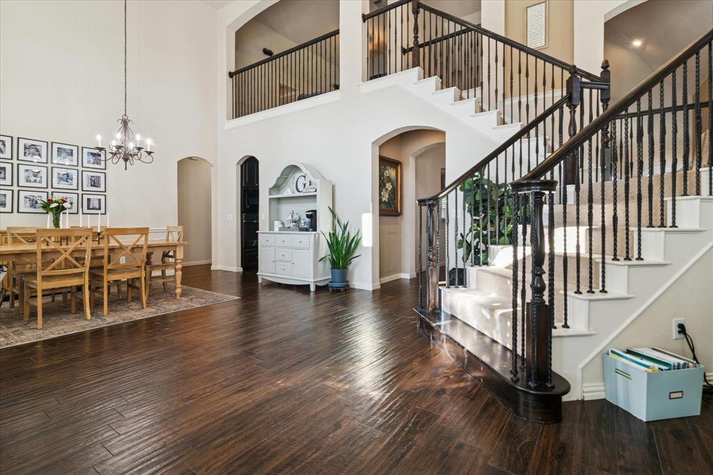 1602 Crown Point Road McKinney, TX 75072 - Photo 5 of 40 a view of entryway and hall with wooden floor
