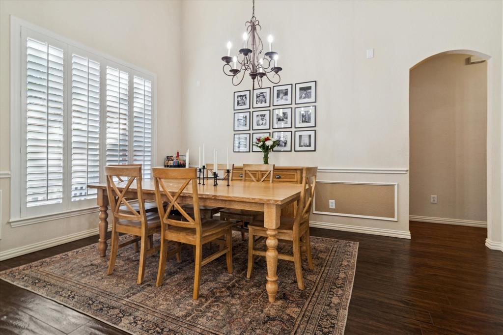 1602 Crown Point Road McKinney, TX 75072 - Photo 6 of 40 a view of a dining room with furniture window and wooden floor