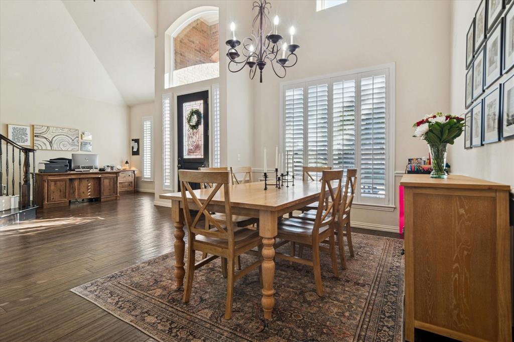 1602 Crown Point Road McKinney, TX 75072 - Photo 7 of 40 a view of a dining room with furniture window and wooden floor