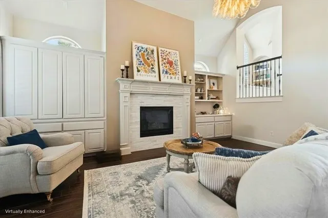 a living room with furniture a rug and a fireplace