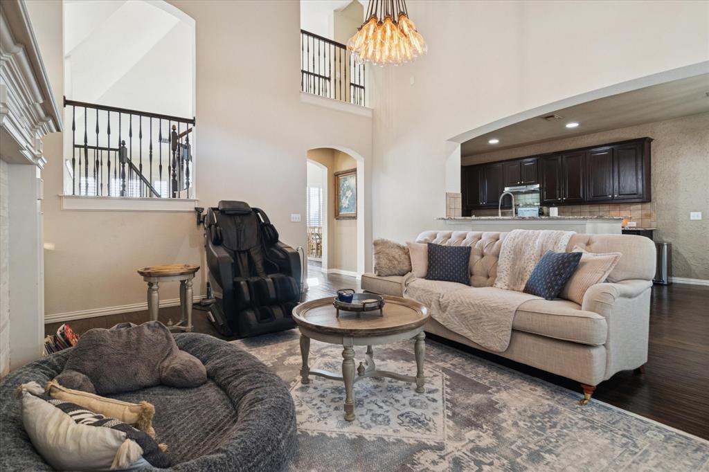 1602 Crown Point Road McKinney, TX 75072 - Photo 10 of 40 a living room with furniture and a wooden floor
