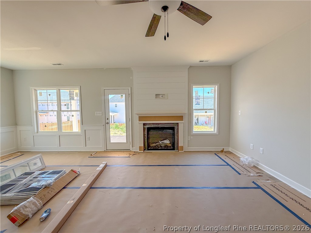 809 Union Street Raeford, NC 28376 - Photo 4 of 9 a view of an empty room with window and fire place