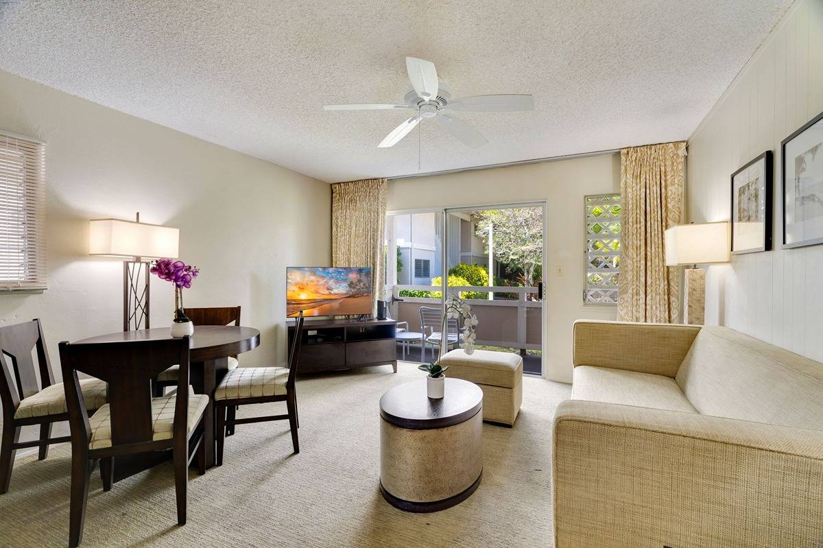 525 Aleka Loop, Unit C5 Kapaa, HI 96746 - Photo 1 of 24 a living room with furniture and a dining room