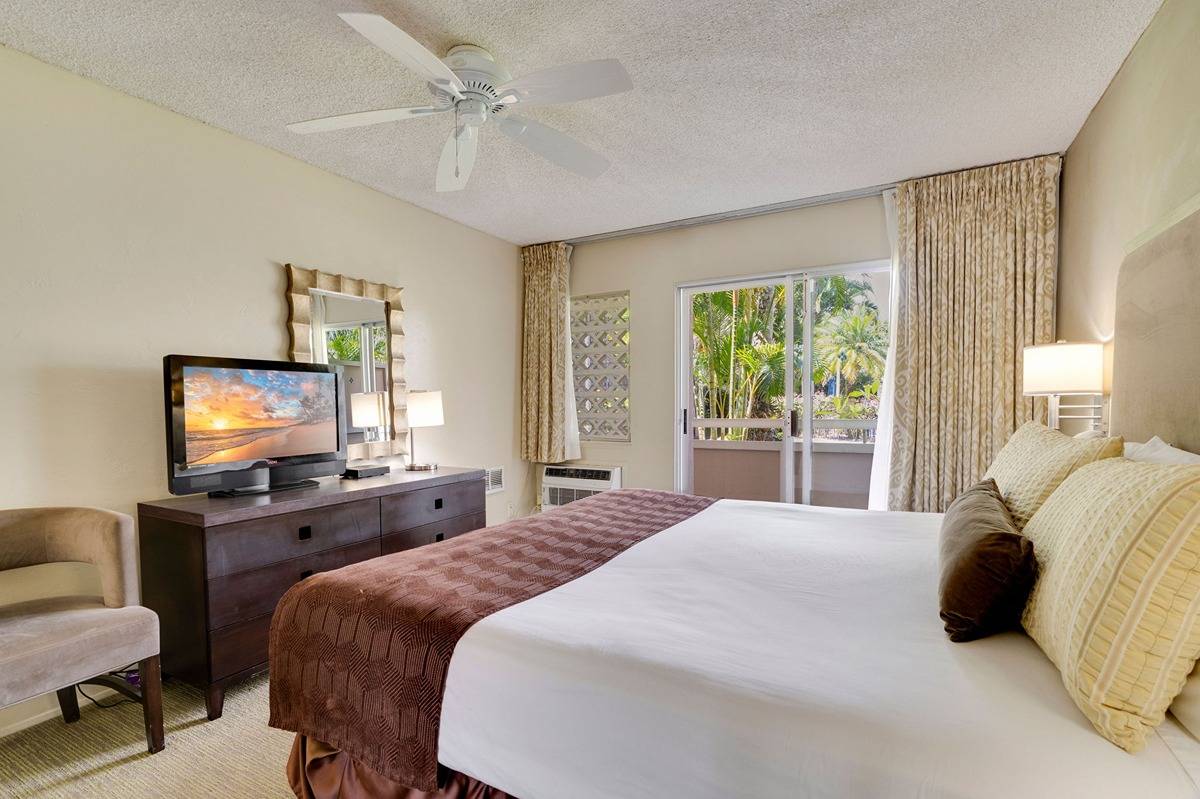 525 Aleka Loop, Unit C5 Kapaa, HI 96746 - Photo 13 of 24 a bedroom with a bed and a flat screen tv