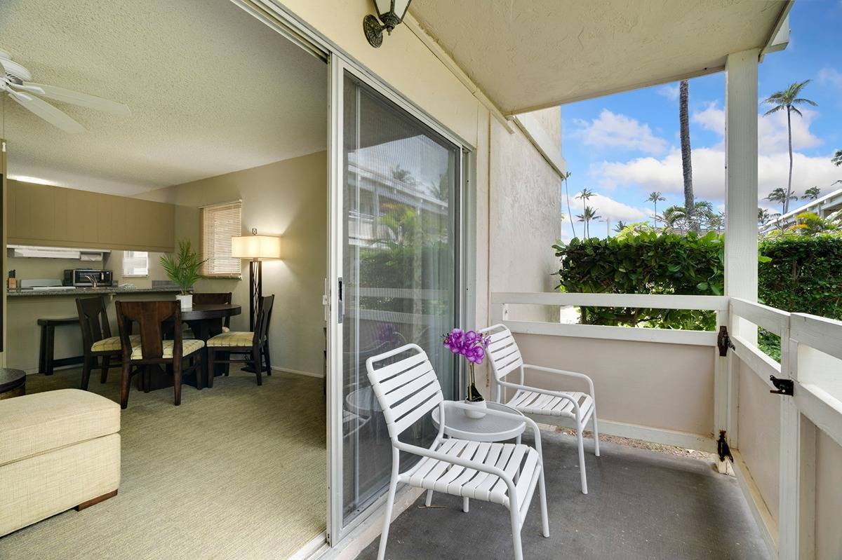 525 Aleka Loop, Unit C5 Kapaa, HI 96746 - Photo 17 of 24 a dining room with furniture and a floor to ceiling window