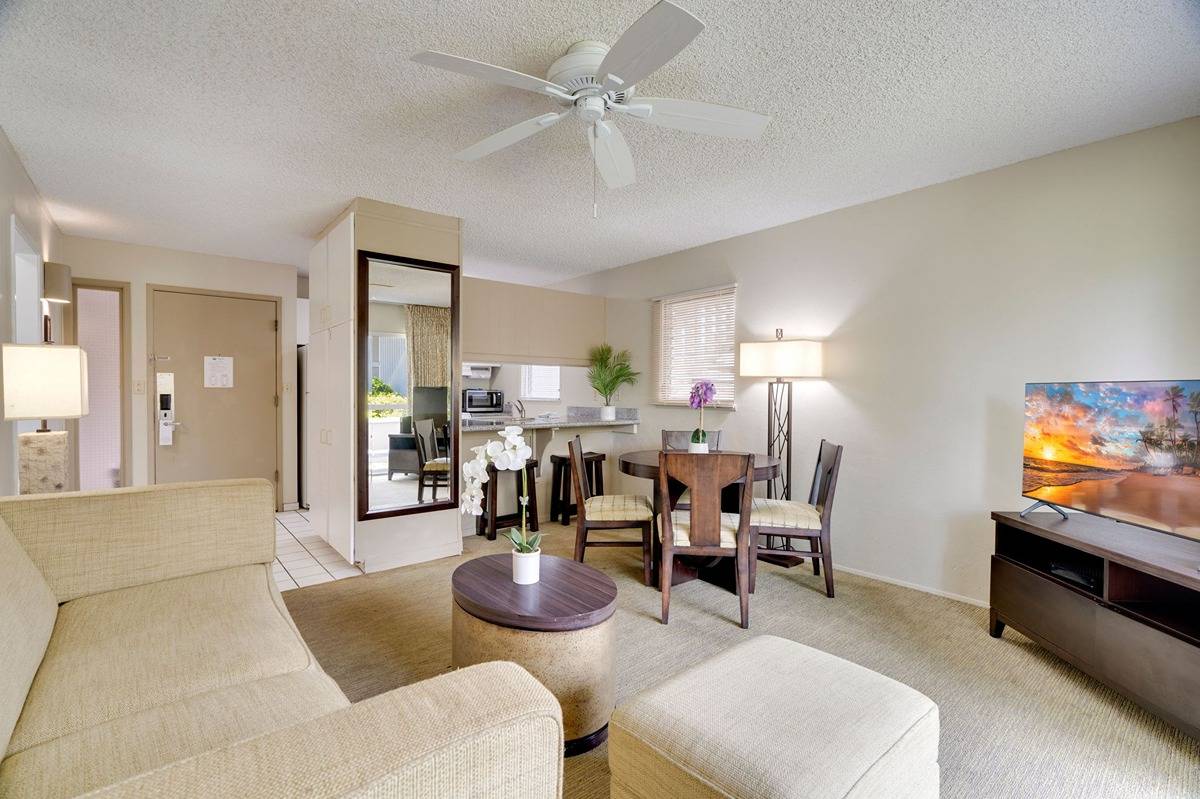 525 Aleka Loop, Unit C5 Kapaa, HI 96746 - Photo 3 of 24 a living room with furniture and a flat screen tv