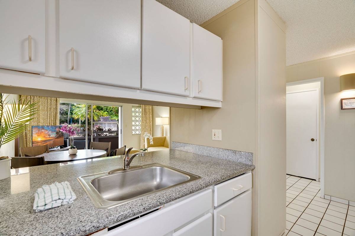 525 Aleka Loop, Unit C5 Kapaa, HI 96746 - Photo 7 of 24 a kitchen with granite countertop a sink and a counter top space