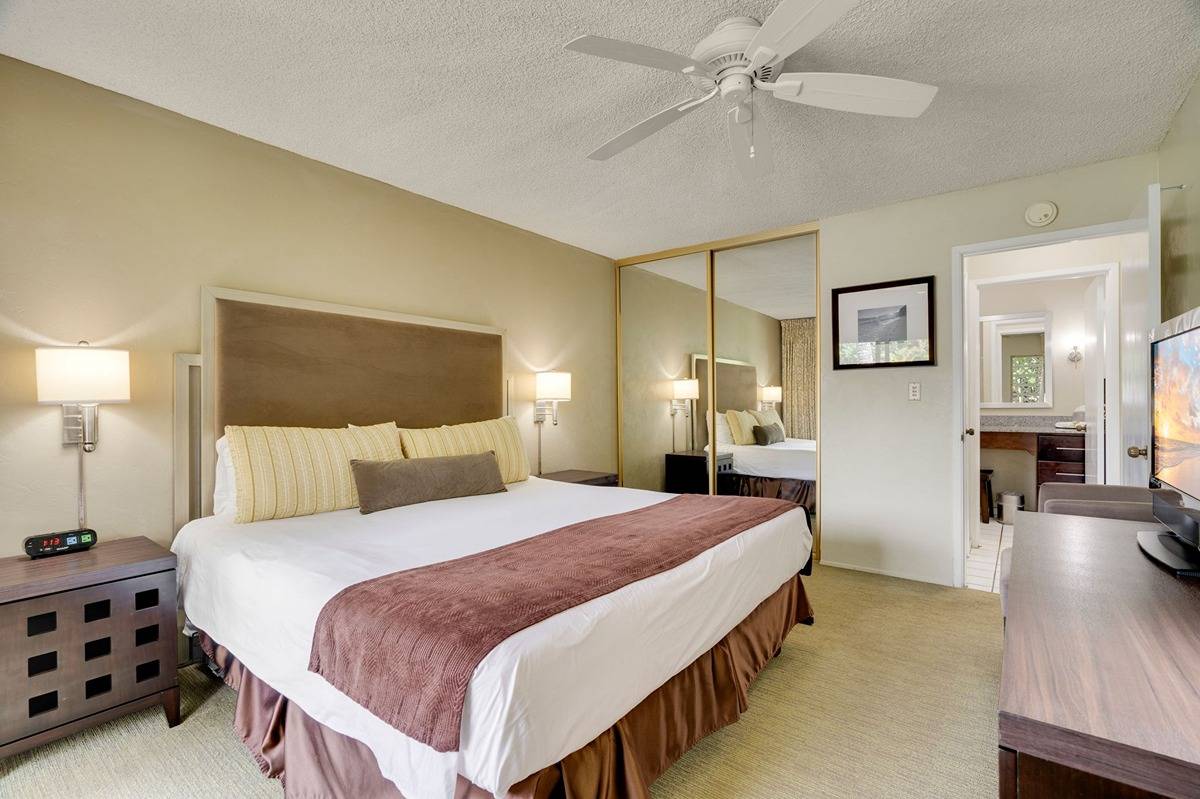 525 Aleka Loop, Unit C5 Kapaa, HI 96746 - Photo 10 of 24 a bedroom with a bed and ceiling fan