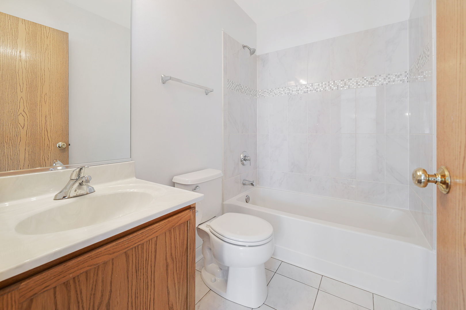 1529 Keystone Court Elgin, IL 60120 - Photo 17 of 22 a bathroom with a sink a toilet and shower
