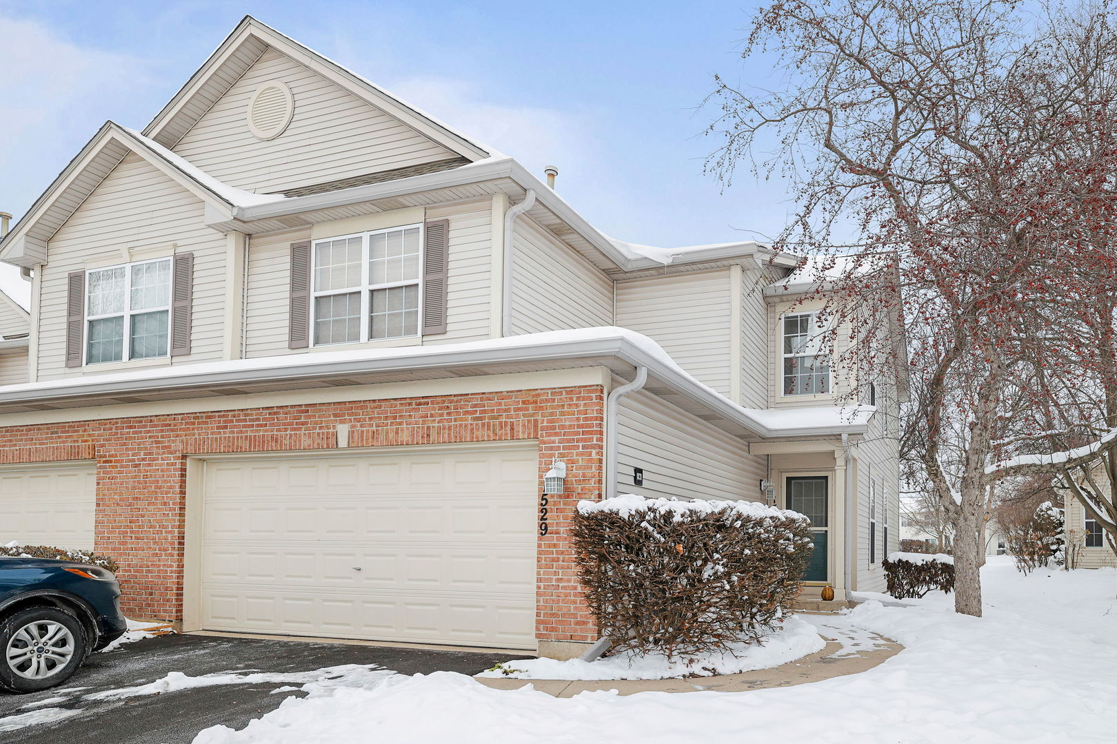 1529 Keystone Court Elgin, IL 60120 - Photo 21 of 22 a front view of a house with a yard and garage
