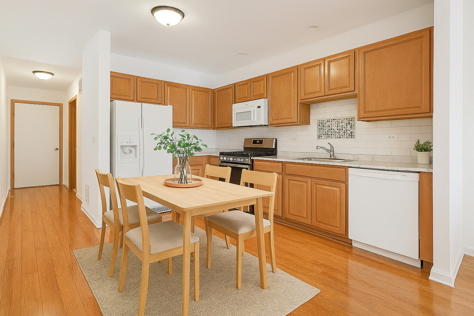 1529 Keystone Court Elgin, IL 60120 - Photo 7 of 22 a kitchen with a sink a cabinets and chairs