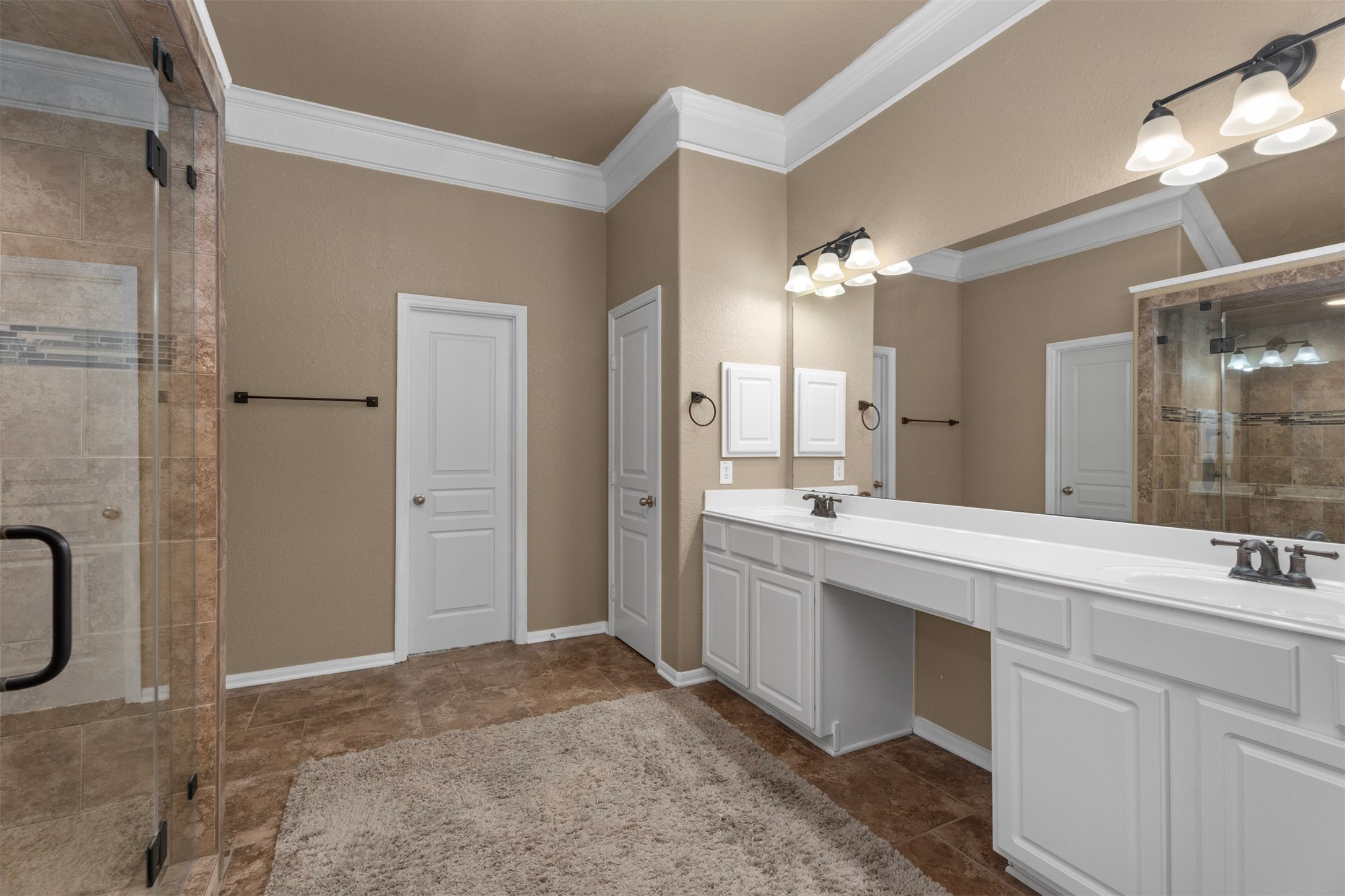 6326 Cash Oaks Drive Spring, TX 77379 - Photo 28 of 49 Spa-like primary ensuite with double sinks and vanity space....and more gorgeous crown molding.