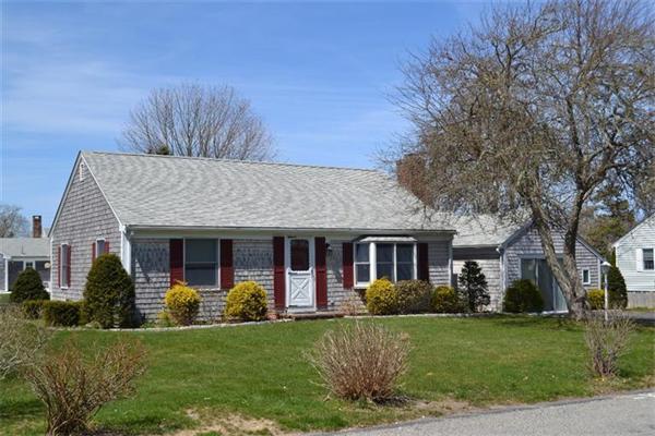 7 Knox Road Dennis, MA 02639 - Photo 1 of 22 a front view of a house with a yard