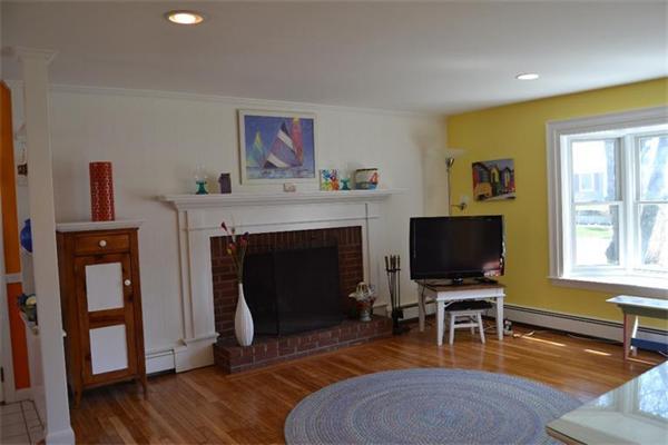 7 Knox Road Dennis, MA 02639 - Photo 5 of 22 a living room with furniture a fireplace and a flat screen tv