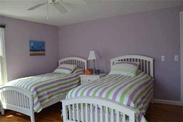 7 Knox Road Dennis, MA 02639 - Photo 7 of 22 a bedroom with two beds and a chandelier