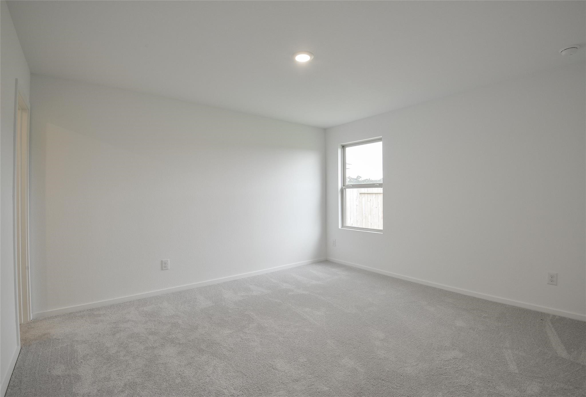 13746 Kit Run Splendora, TX 77372 - Photo 12 of 22 an empty room with a window