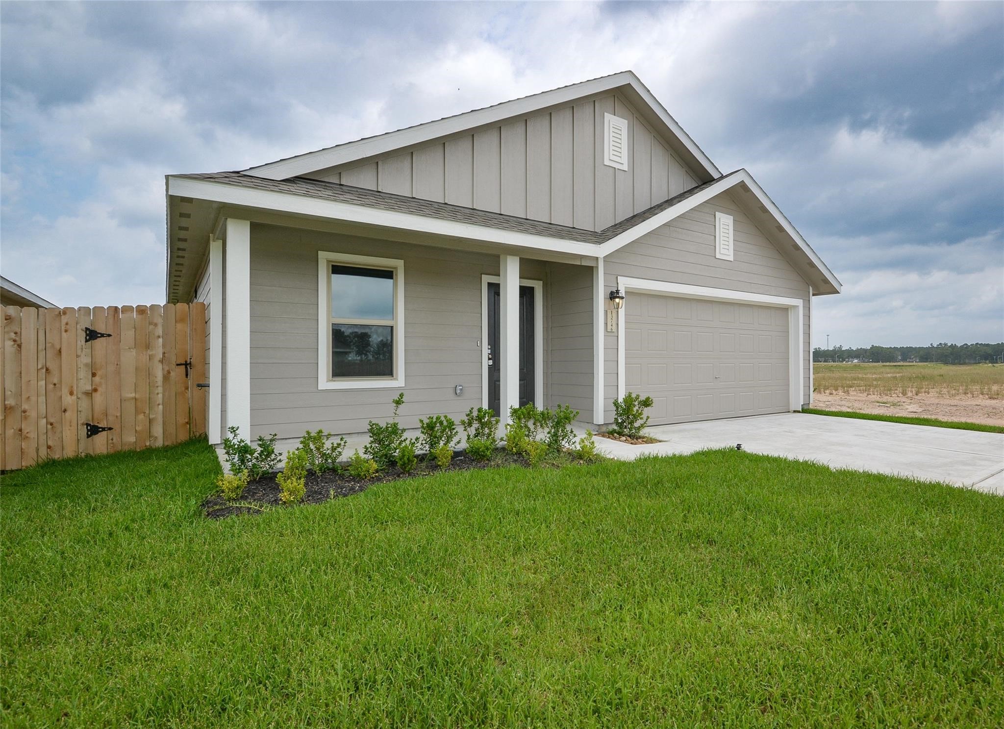 13746 Kit Run Splendora, TX 77372 - Photo 2 of 22 a front view of house with yard