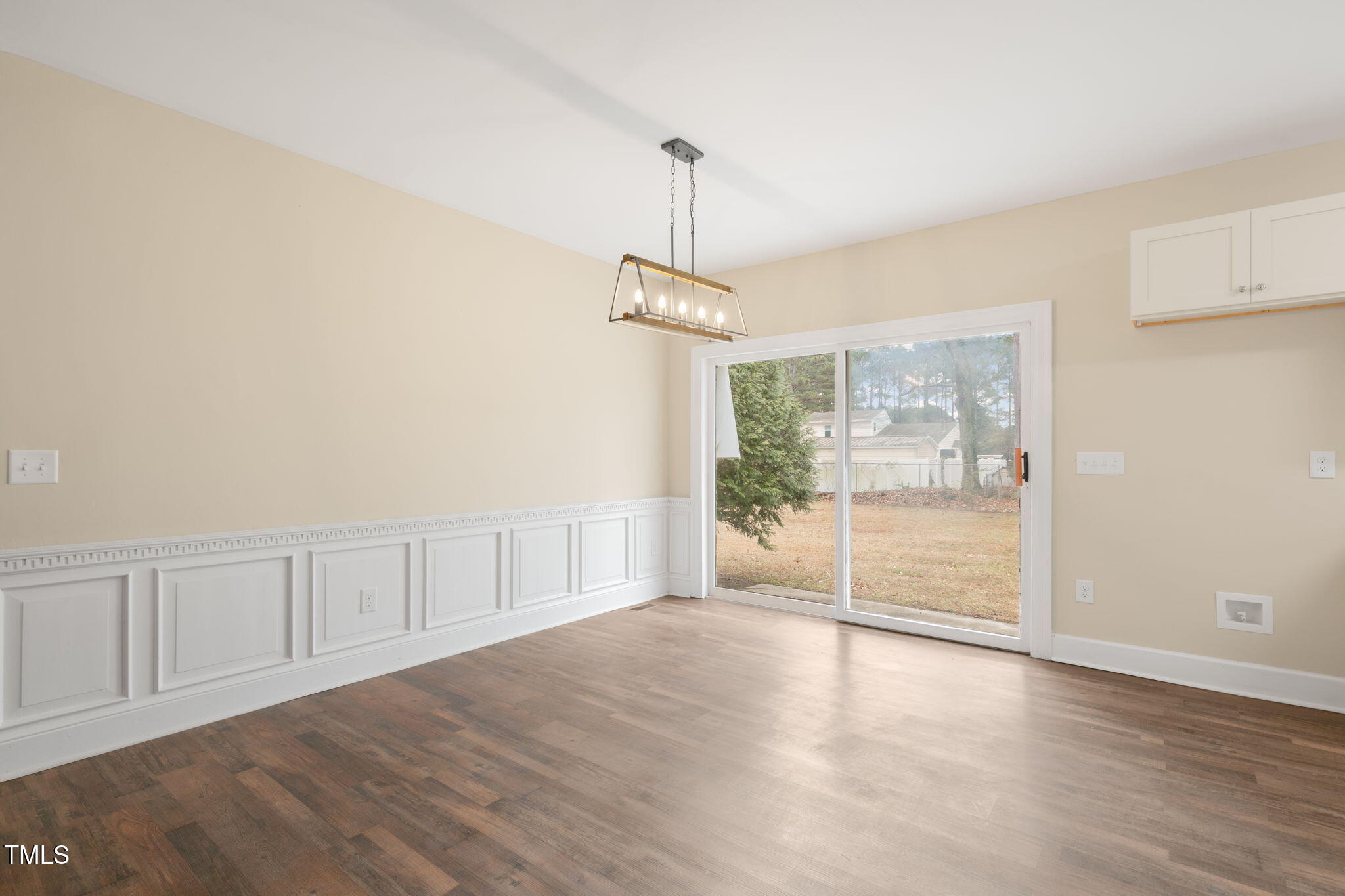 1109 Peachtree Road Northwest Wilson, NC 27896 - Photo 12 of 41 a view of an empty room with wooden floor and a window