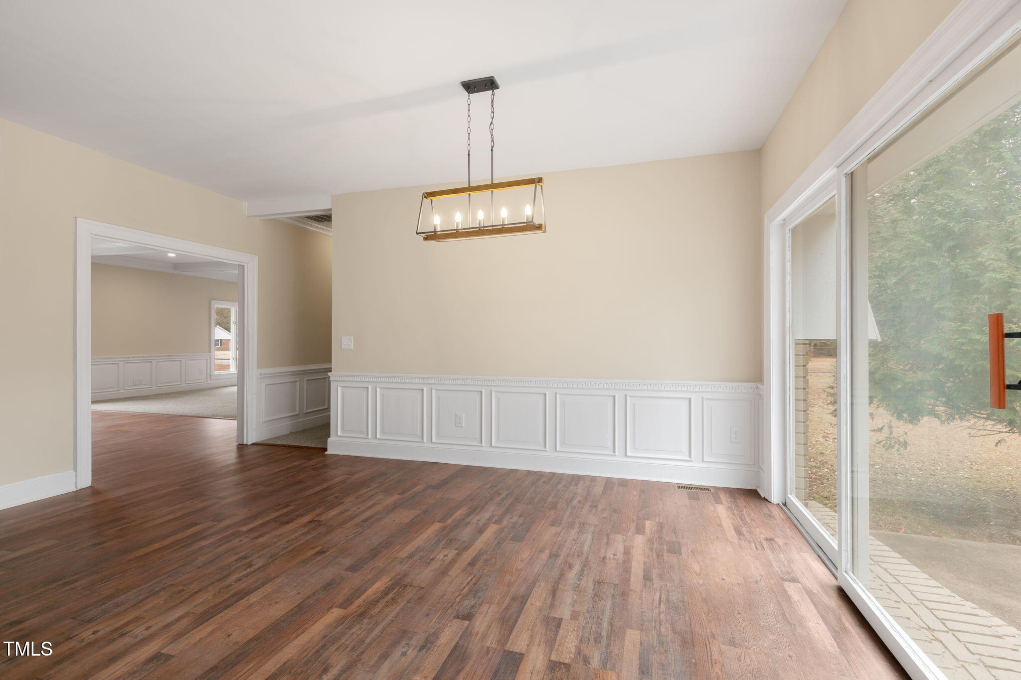 1109 Peachtree Road Northwest Wilson, NC 27896 - Photo 13 of 41 a view of an empty room with wooden floor and a window