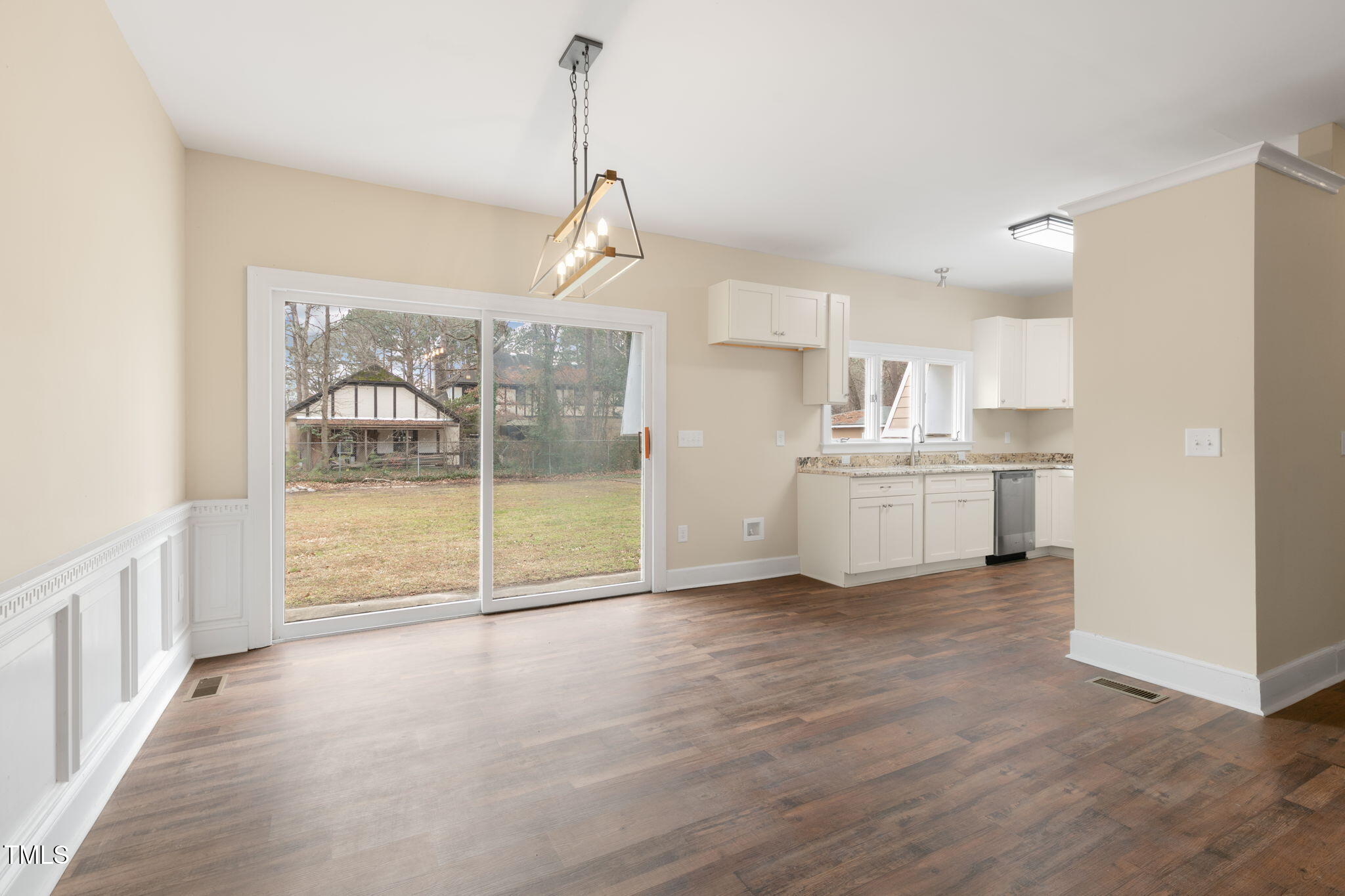1109 Peachtree Road Northwest Wilson, NC 27896 - Photo 14 of 41 a view of a kitchen with wooden floor and a window