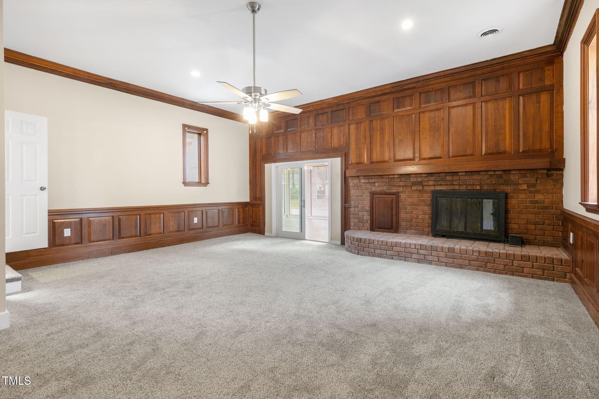 1109 Peachtree Road Northwest Wilson, NC 27896 - Photo 15 of 41 a view of an empty room with a fireplace and a window