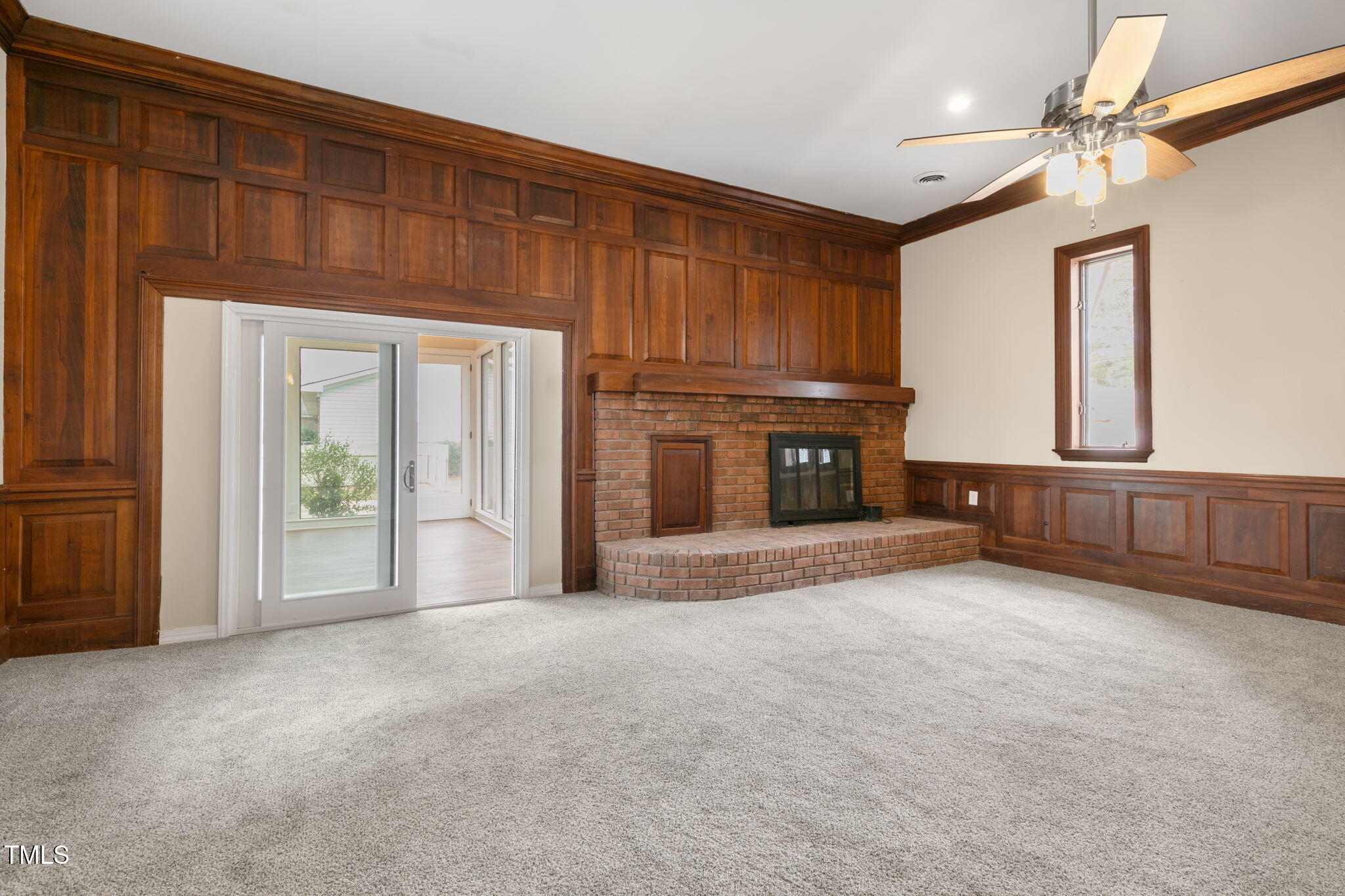1109 Peachtree Road Northwest Wilson, NC 27896 - Photo 16 of 41 a view of an empty room with a fireplace and a window