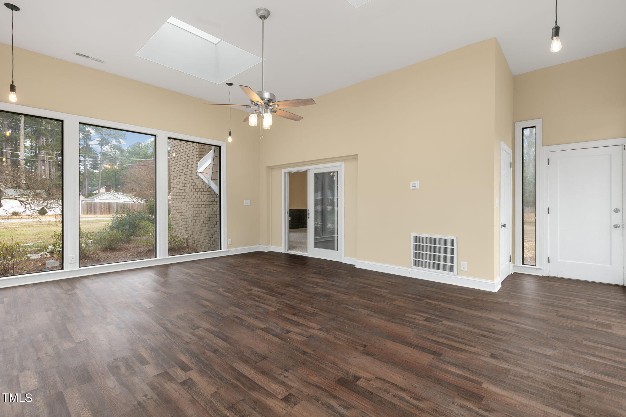 1109 Peachtree Road Northwest Wilson, NC 27896 - Photo 19 of 41 a view of an empty room with wooden floor and a window