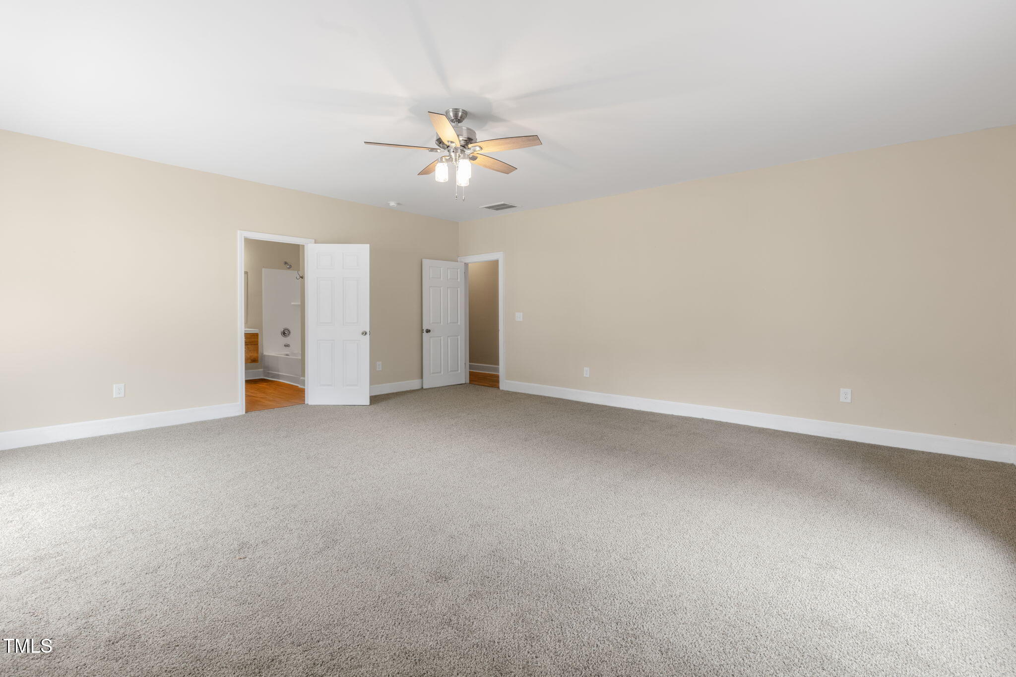 1109 Peachtree Road Northwest Wilson, NC 27896 - Photo 22 of 41 an empty room with a ceiling fan and a window