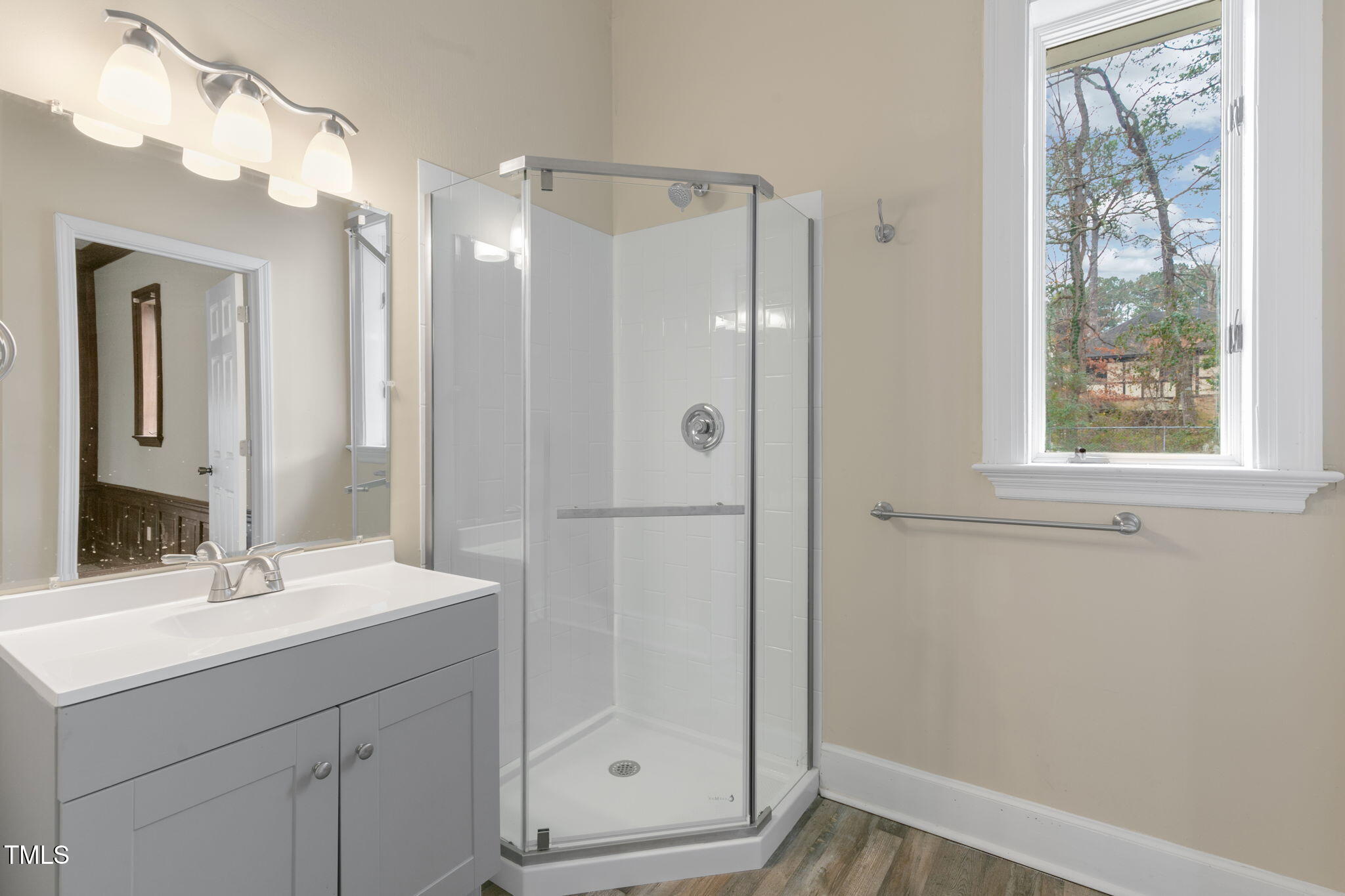 1109 Peachtree Road Northwest Wilson, NC 27896 - Photo 32 of 41 a bathroom with a shower sink and mirror
