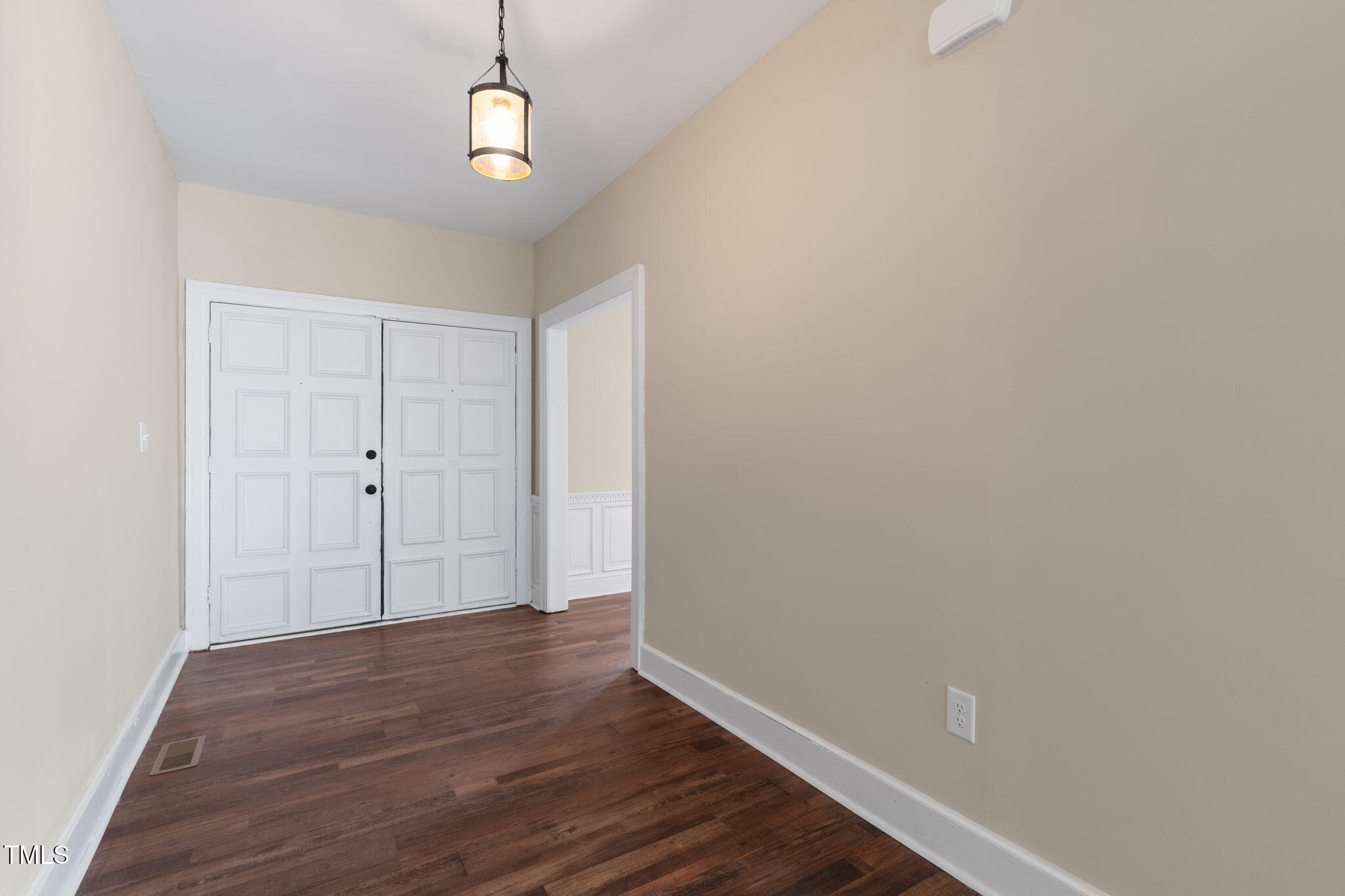 1109 Peachtree Road Northwest Wilson, NC 27896 - Photo 4 of 41 a view of an empty room with wooden floor