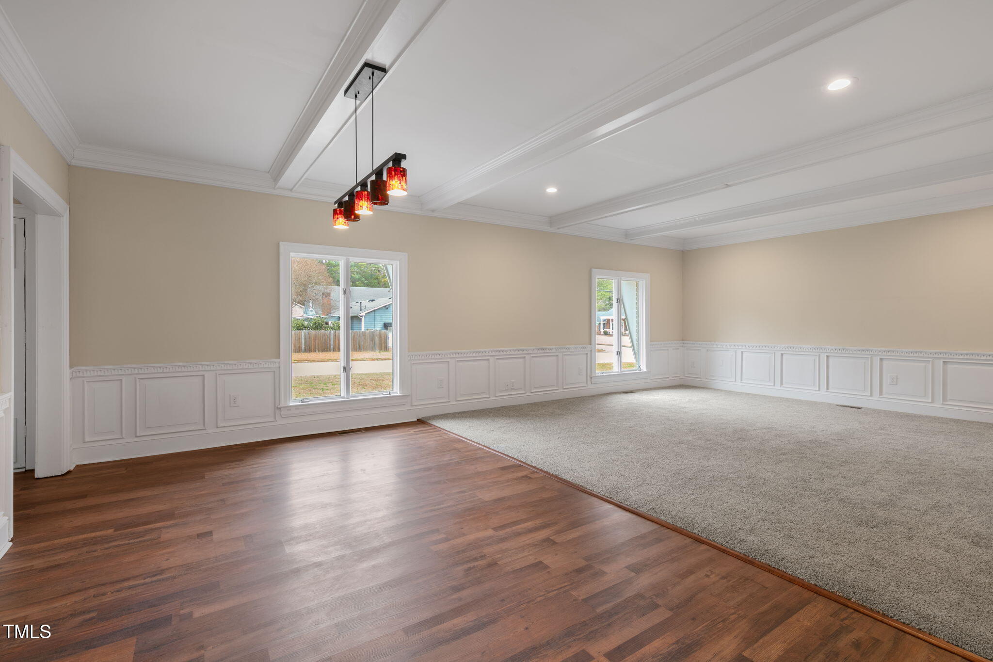 1109 Peachtree Road Northwest Wilson, NC 27896 - Photo 5 of 41 a view of an empty room with wooden floor and a window