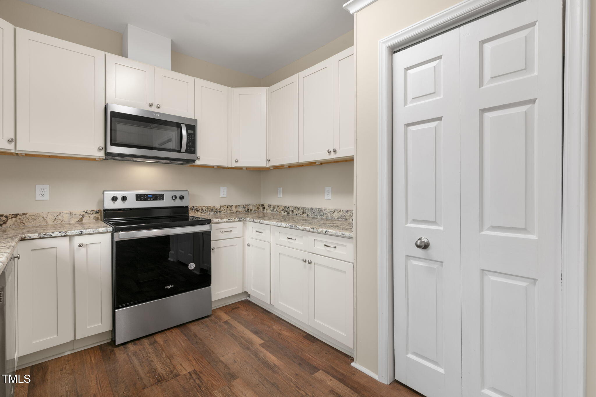 1109 Peachtree Road Northwest Wilson, NC 27896 - Photo 9 of 41 a kitchen with granite countertop white cabinets and stainless steel appliances