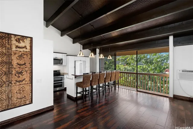 a view of a chairs and table in a patio