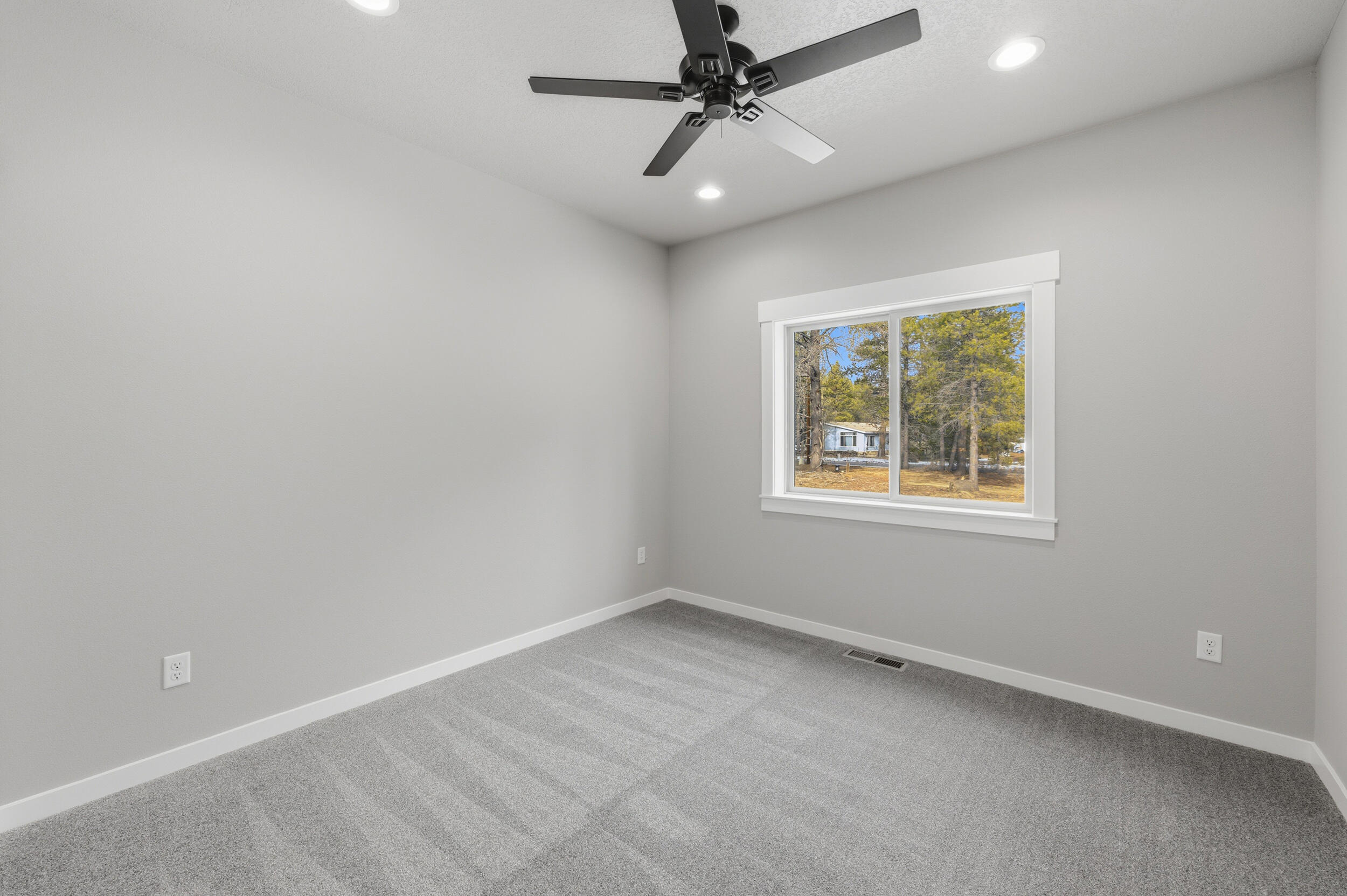 16083 Dyke Road, Unit 9 La Pine, OR 97739 - Photo 36 of 53 an empty room with a window and a fan