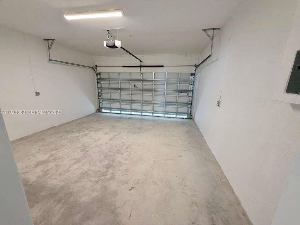 15549 Southwest 280th Street, Unit 6 Homestead, FL 33032 - Photo 4 of 13 a view of a room with an empty racks