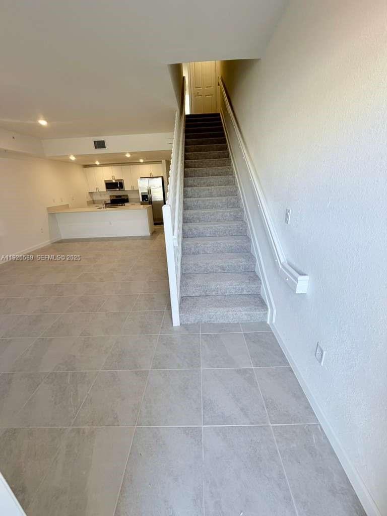 15549 Southwest 280th Street, Unit 6 Homestead, FL 33032 - Photo 5 of 13 a view of entryway and kitchen
