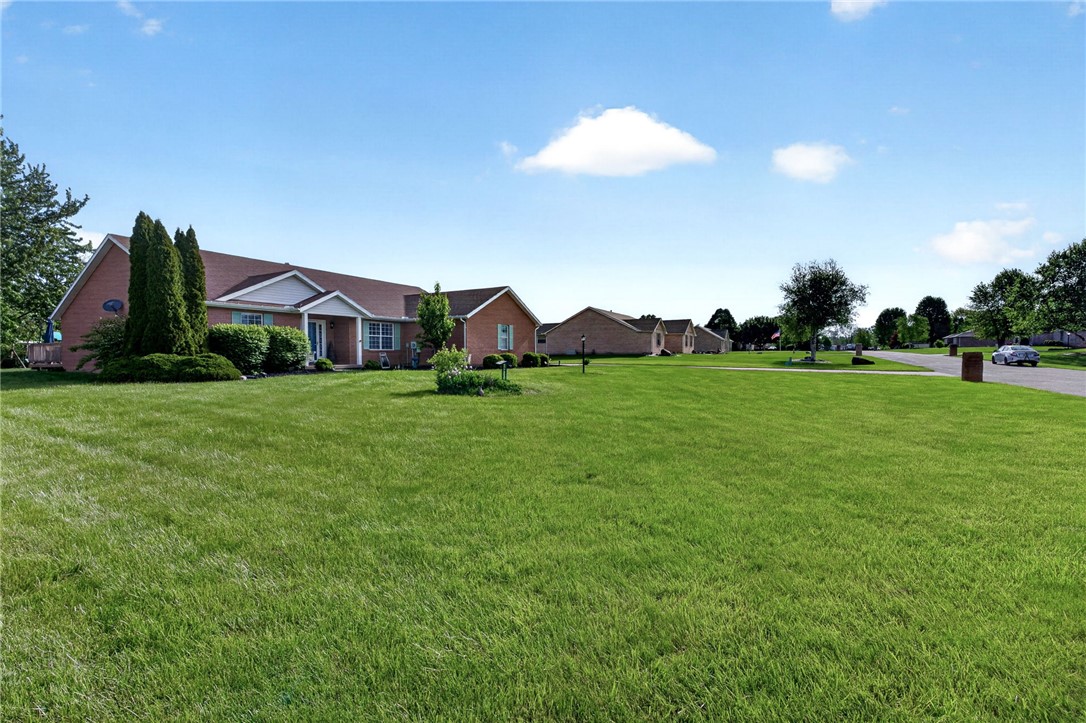 4996 Shannon Avenue Springfield, OH 45504 - Photo 45 of 61 This spacious property features a charming brick exterior with lush green landscaping.