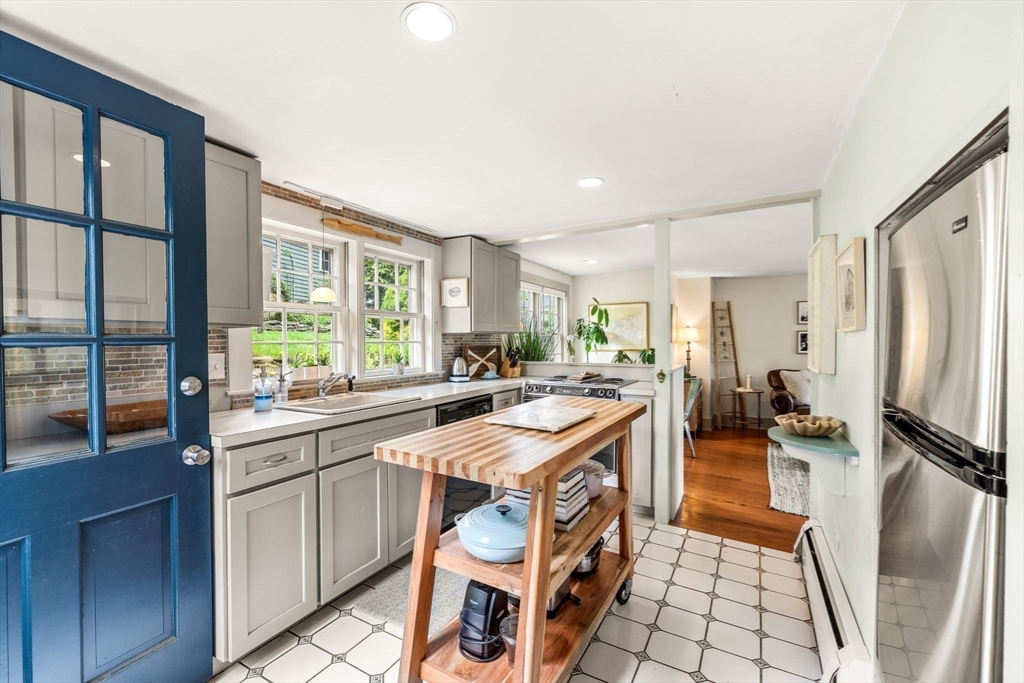 159 Elm Street, Unit 2 Marblehead, MA 01945 - Photo 12 of 34 a kitchen with a sink stove and cabinets