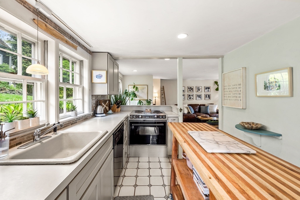 159 Elm Street, Unit 2 Marblehead, MA 01945 - Photo 14 of 34 a kitchen with a sink stove and cabinets